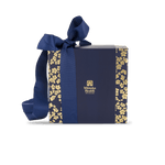 Manuka honey MGO 400+ gift set with spoon in blue gift box with gold floral patterns and a blue ribbon, featuring the Manuka Health logo.