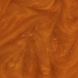 Close-up of a brown, textured surface of Manuka Health Manuka Honey Reserve MGO 1000+