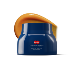 Blue jar of Manuka honey with honey swatch behind it. 
