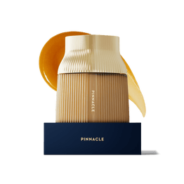 Pinnacle MGO 1600+ glass Manuka Honey jar with a gold cap.